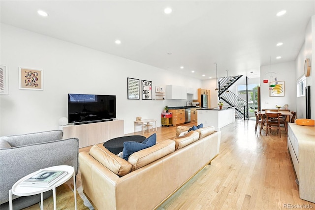 4129 Zenobia St, Denver, CO 80212 - living room with stairway, light wood-style flooring, and recessed lighting