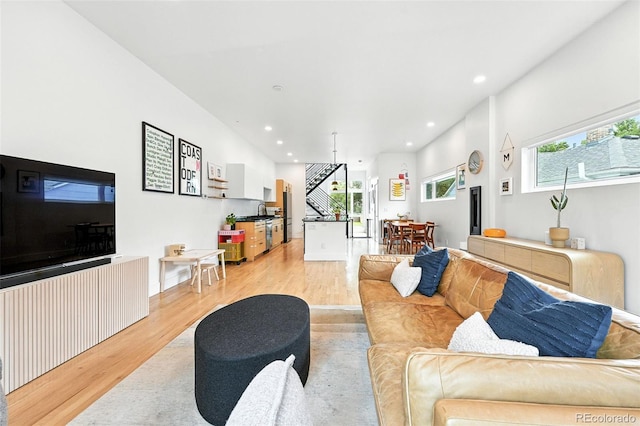 4129 Zenobia St, Denver, CO 80212 - living area with light wood-style floors, stairs, and recessed lighting