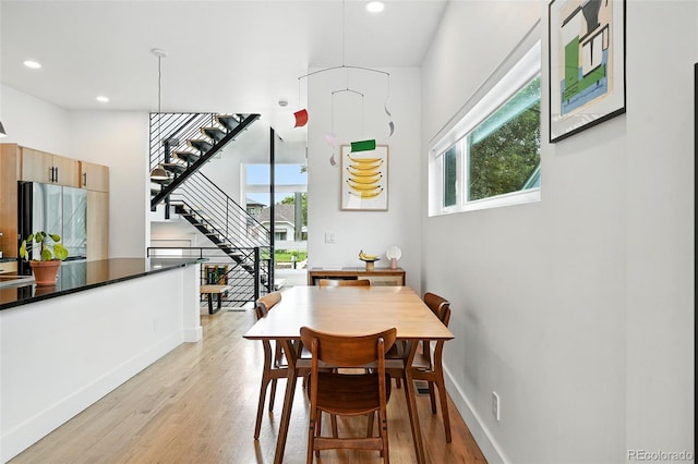 4129 Zenobia St, Denver, CO 80212 - dining space featuring stairs, light wood-type flooring, and recessed lighting