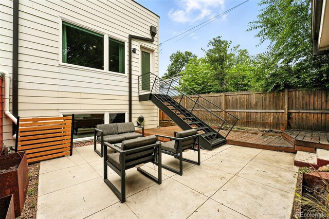 4129 Zenobia St, Denver, CO 80212 - fenced backyard featuring a patio, an outdoor hangout area, stairway, and a deck