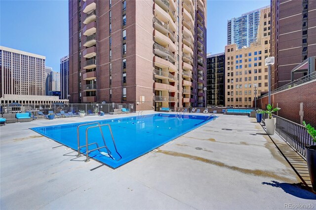 view of swimming pool featuring a patio area