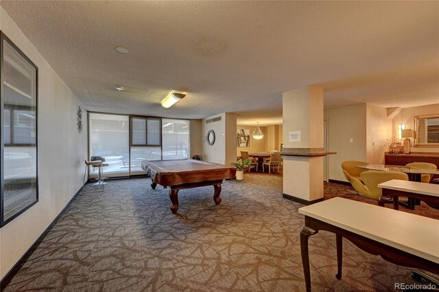 recreation room featuring pool table, carpet floors, and a textured ceiling