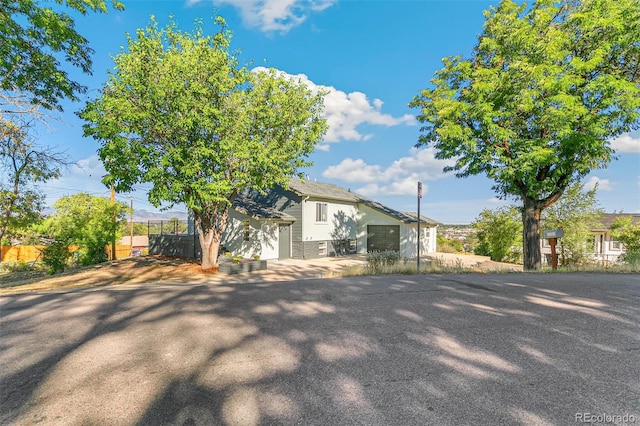 5385 W 51st Ave, Denver, CO 80212 - view of side of home featuring fence and driveway