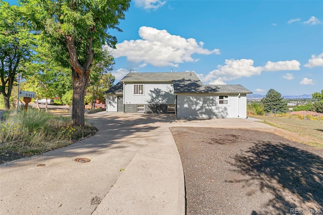 5385 W 51st Ave, Denver, CO 80212 - split level home featuring concrete driveway