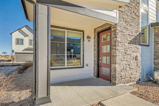 doorway to property featuring a garage