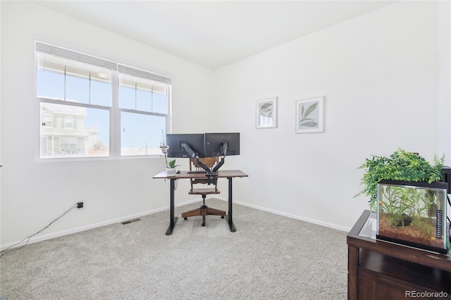 carpeted home office featuring baseboards and visible vents