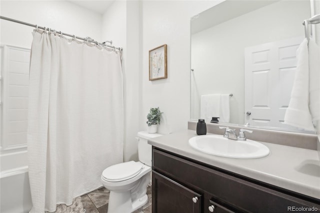 full bath featuring toilet, vanity, and shower / bath combo