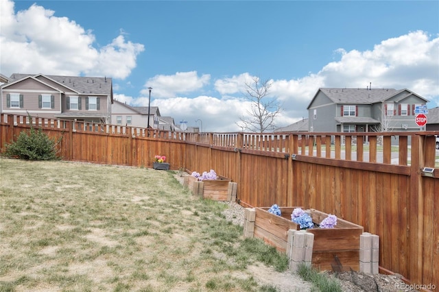view of yard with a residential view and fence