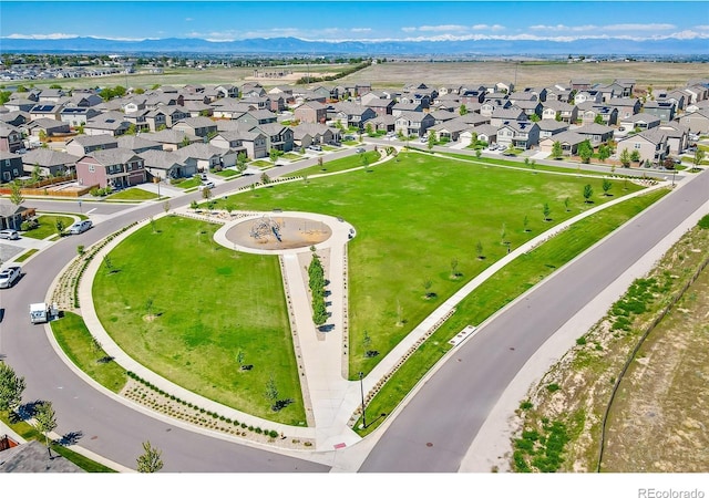 birds eye view of property with a mountain view and a residential view