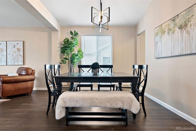 dining space with an inviting chandelier and dark wood-type flooring