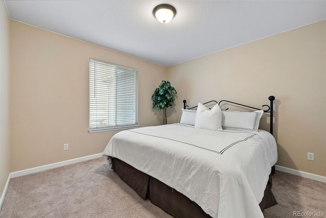 bedroom with light carpet