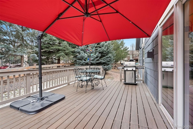 wooden deck featuring area for grilling