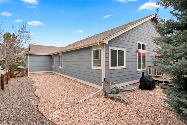 view of side of home with a wooden deck