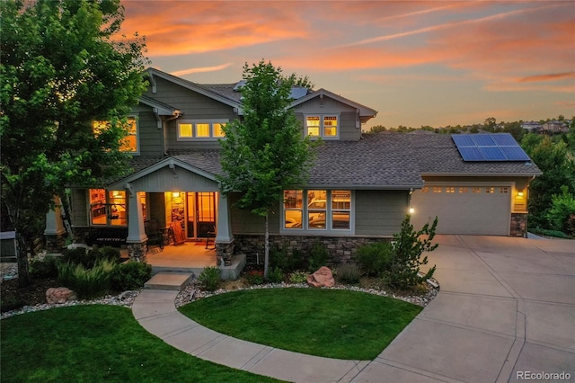 24965 E Roxbury Pl, Aurora, CO 80016 - craftsman house featuring a porch, stone siding, and a front yard