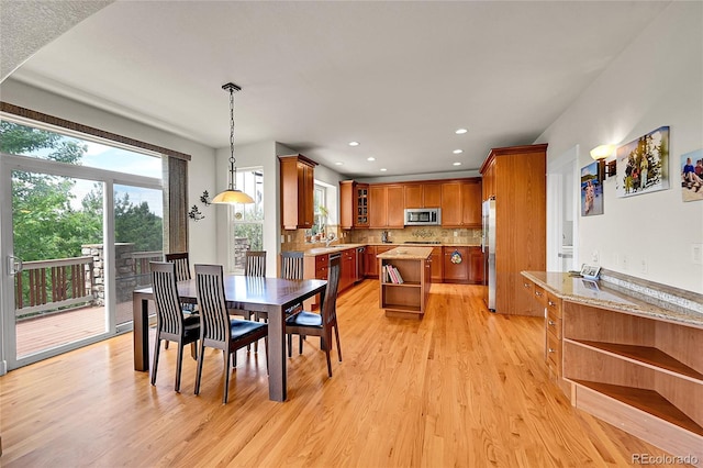 24965 E Roxbury Pl, Aurora, CO 80016 - dining space with light wood finished floors and recessed lighting