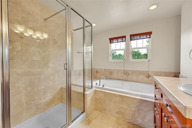 24965 E Roxbury Pl, Aurora, CO 80016 - full bathroom featuring tile patterned flooring, a shower stall, a bath, and vanity