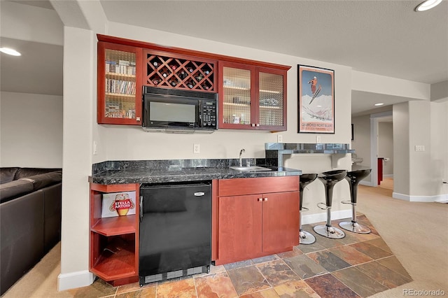 24965 E Roxbury Pl, Aurora, CO 80016 - indoor wet bar featuring black appliances, recessed lighting, and light carpet