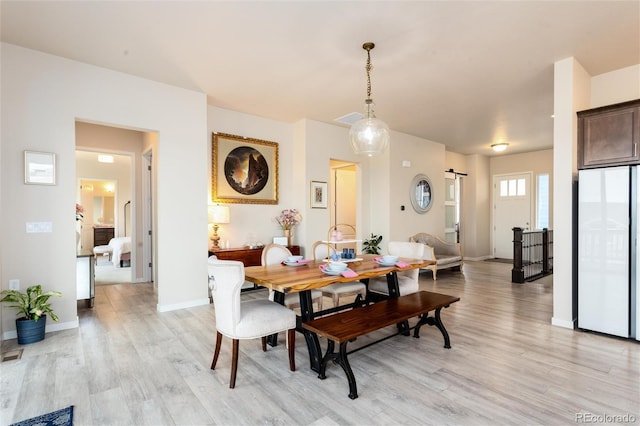 6657 S Kline Way, Littleton, CO 80127 - dining room with light wood-style floors and baseboards