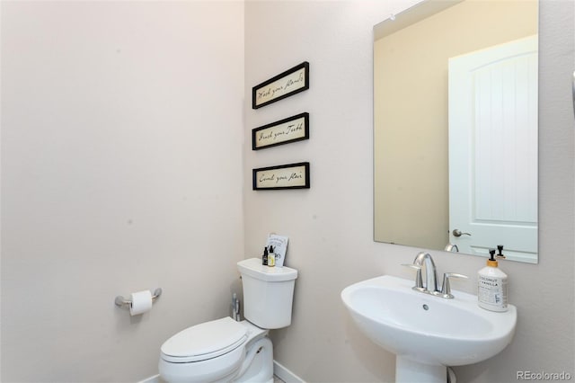 6657 S Kline Way, Littleton, CO 80127 - half bathroom with a sink, baseboards, and toilet