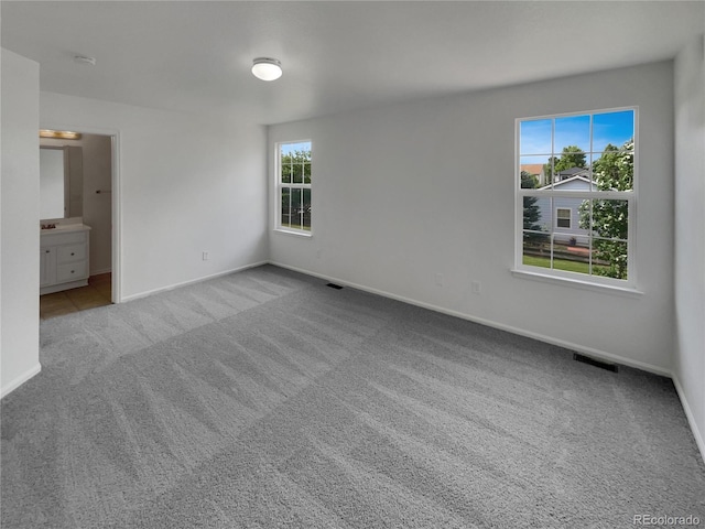16453 E Phillips Dr, Englewood, CO 80112 - unfurnished bedroom featuring carpet floors and ensuite bath
