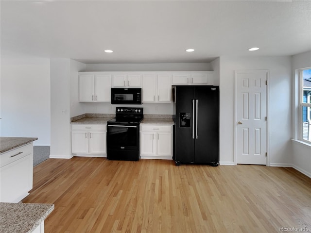 16453 E Phillips Dr, Englewood, CO 80112 - kitchen featuring black appliances, light wood-type flooring, white cabinetry, and recessed lighting