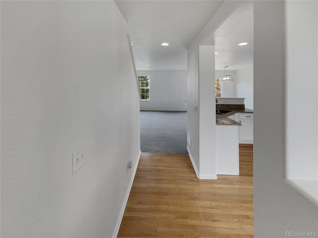 16453 E Phillips Dr, Englewood, CO 80112 - hall with light wood-type flooring and recessed lighting