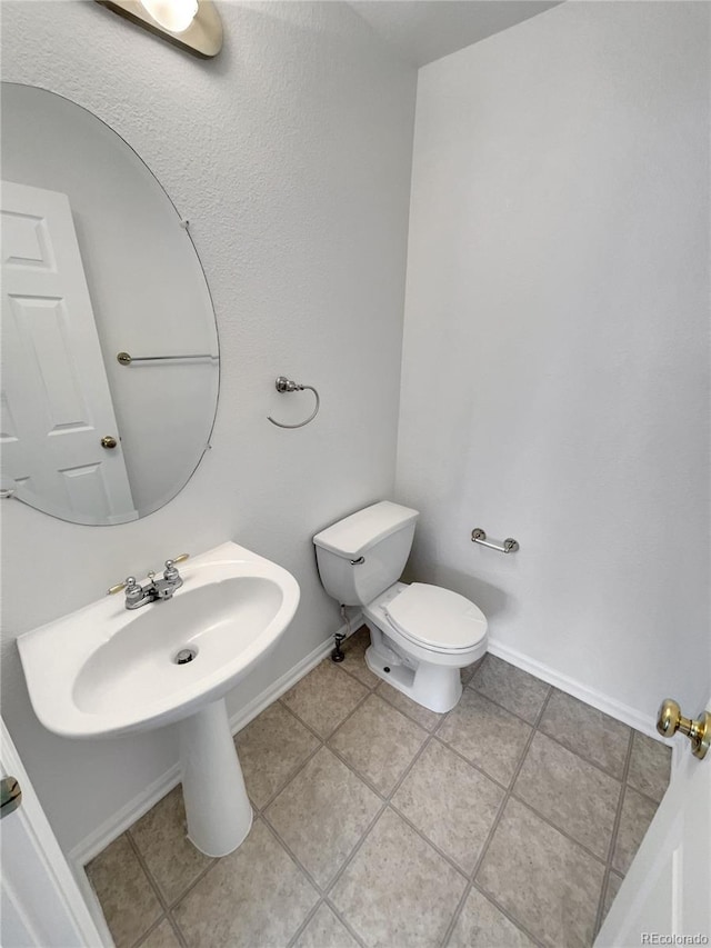 16453 E Phillips Dr, Englewood, CO 80112 - half bath with toilet and tile patterned floors