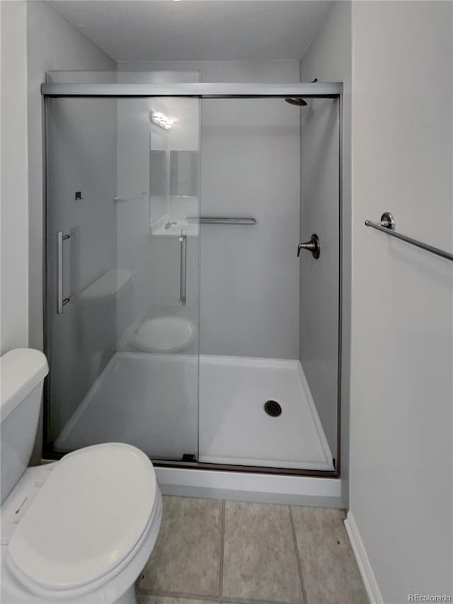 16453 E Phillips Dr, Englewood, CO 80112 - bathroom with a shower stall and tile patterned flooring
