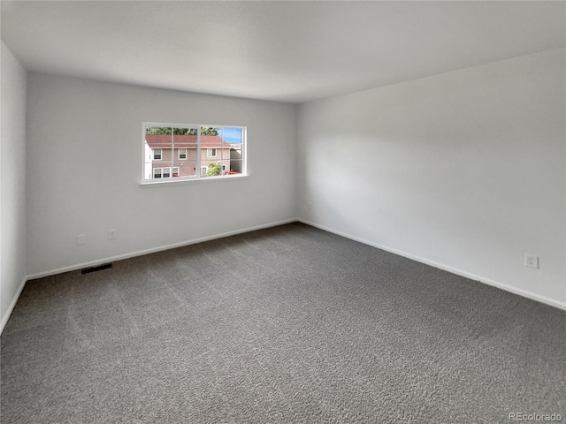 16453 E Phillips Dr, Englewood, CO 80112 - unfurnished room with dark carpet and baseboards