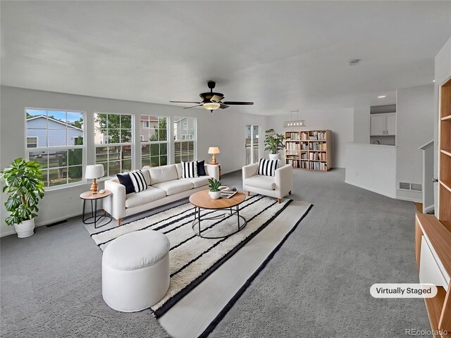 16453 E Phillips Dr, Englewood, CO 80112 - carpeted living area with a ceiling fan and baseboards