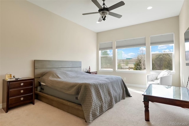 bedroom with a ceiling fan, recessed lighting, light colored carpet, and baseboards