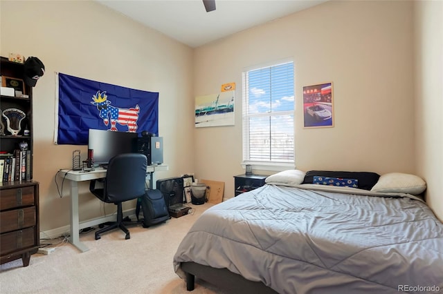 carpeted bedroom featuring baseboards