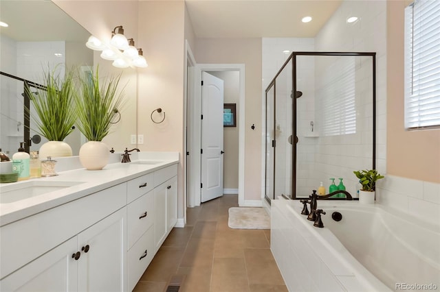 full bath with a garden tub, double vanity, a sink, and a shower stall