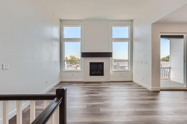 unfurnished living room featuring dark hardwood / wood-style flooring