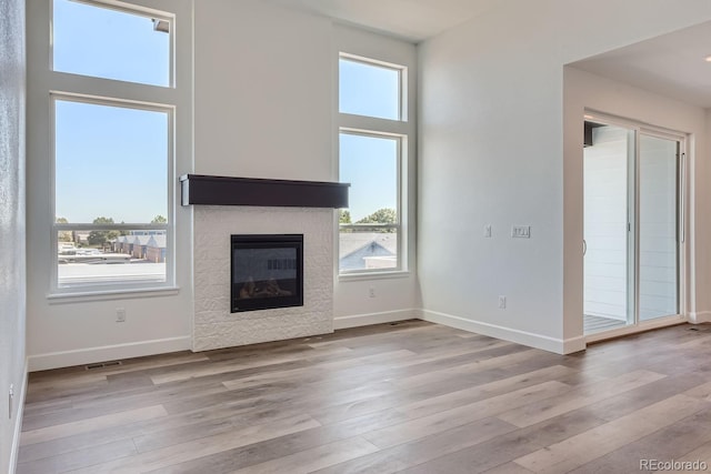 unfurnished living room featuring light hardwood / wood-style flooring