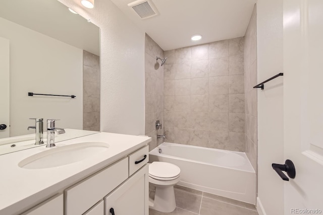 full bathroom with tile patterned floors, vanity, toilet, and tiled shower / bath