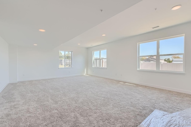 spare room with light colored carpet