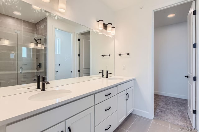 bathroom with tile patterned floors, vanity, and an enclosed shower