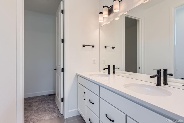 bathroom with tile patterned flooring and vanity