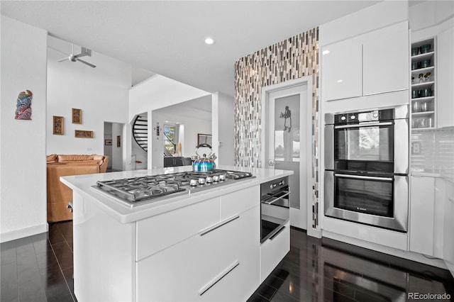 kitchen featuring light countertops, appliances with stainless steel finishes, modern cabinets, white cabinets, and ceiling fan