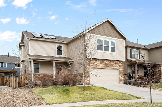 view of front of property featuring solar panels, a porch, fence, and stone siding