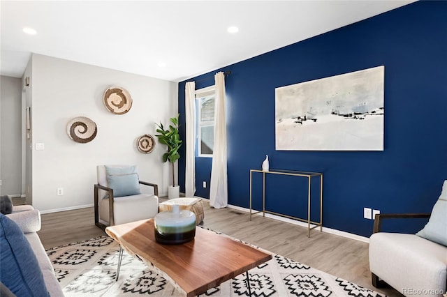 sitting room featuring recessed lighting, baseboards, and wood finished floors