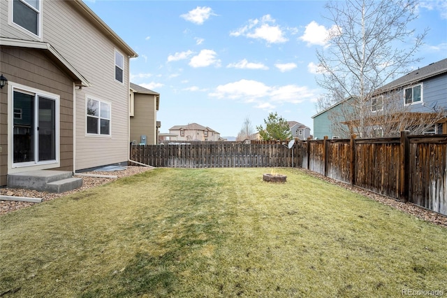 view of yard featuring a residential view and a fenced backyard