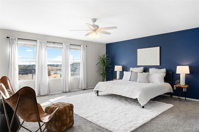 bedroom with baseboards, carpet, and ceiling fan