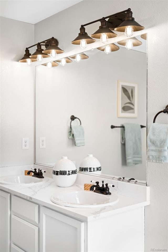 bathroom featuring double vanity and a sink