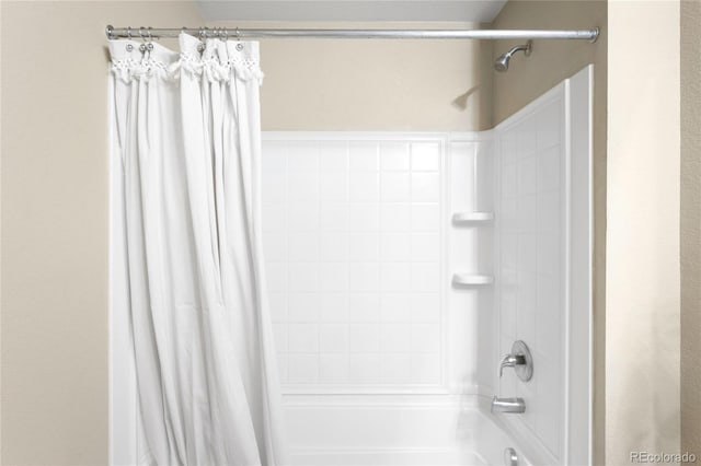 bathroom featuring shower / bath combo with shower curtain