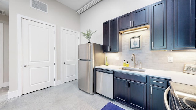 kitchen with stainless steel appliances, light countertops, visible vents, backsplash, and a sink