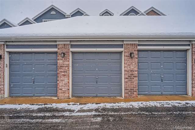 view of snow covered garage