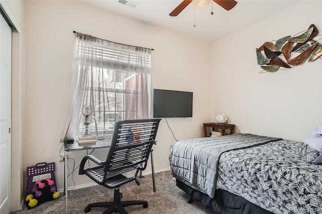 bedroom with ceiling fan, a closet, and carpet floors