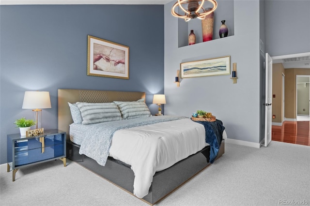 bedroom with baseboards and carpet floors